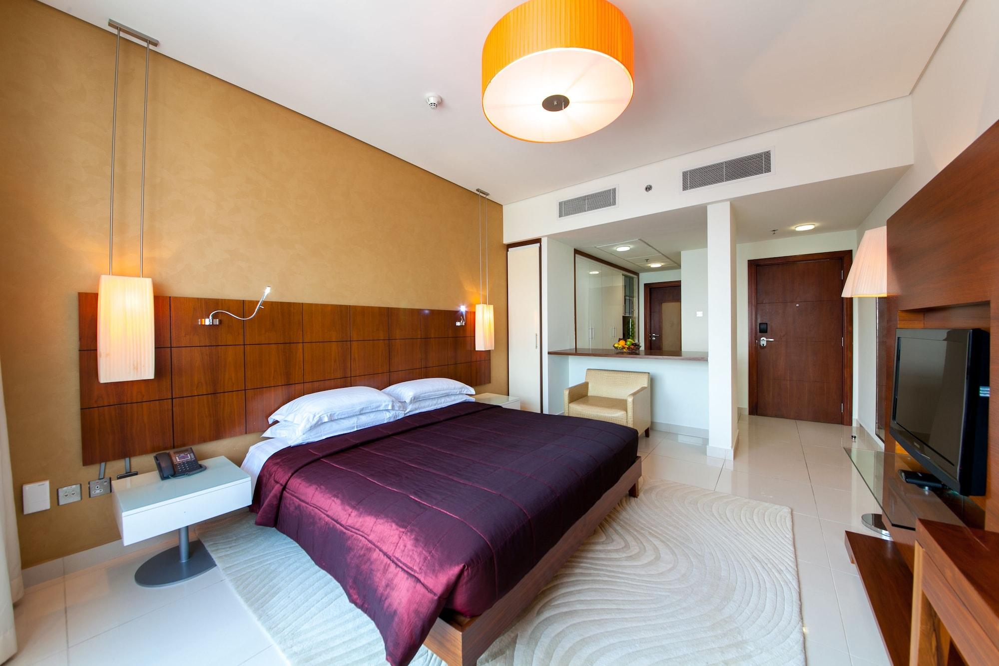 ฟราเซอร์ สวีทส์ โดฮา Aparthotel ภายนอก รูปภาพ A bedroom at the hotel
